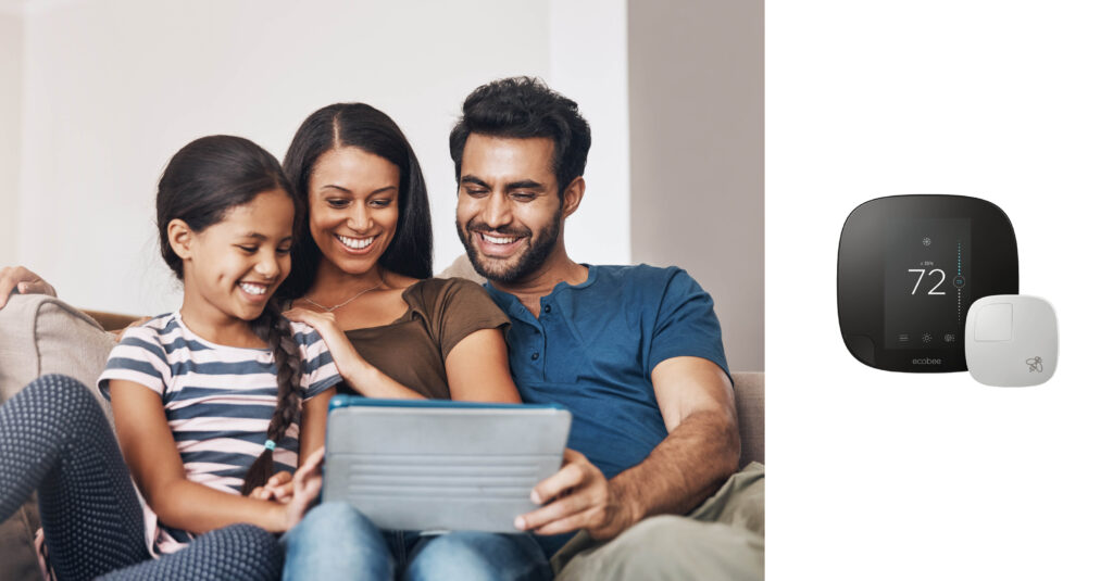 family sitting together and looking at an iPad