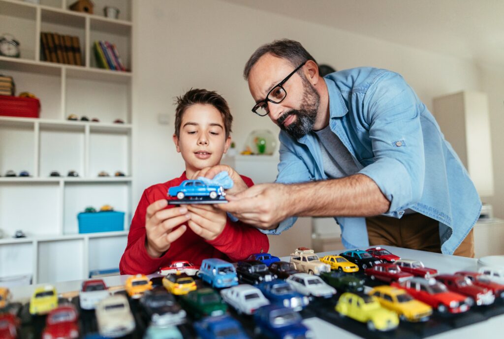 father and son with model cars