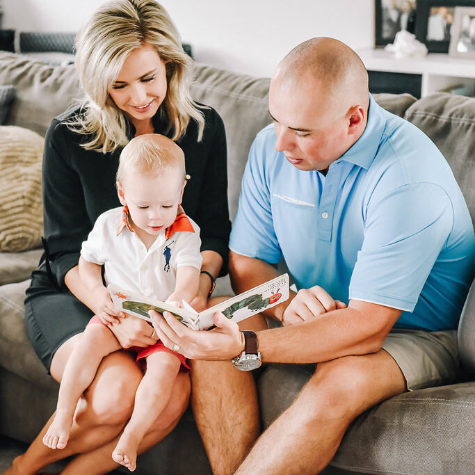 parents reading with toddler